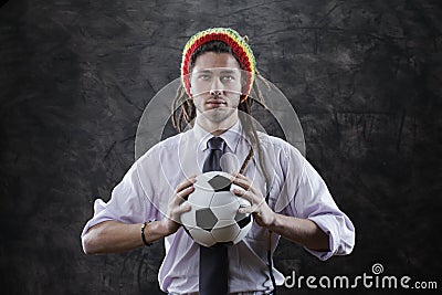Young businessman with a soccer ball Stock Photo
