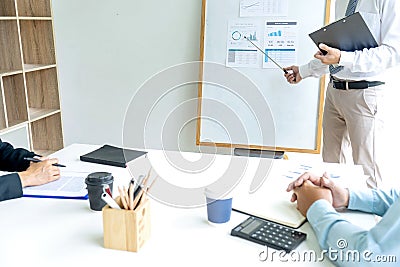 Young businessman stand in front of the group Stock Photo