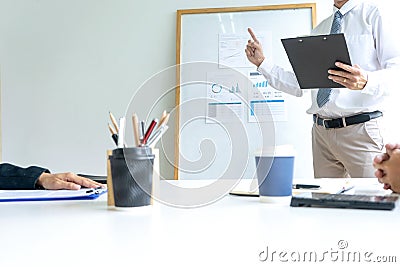 Young businessman stand in front of the group Stock Photo