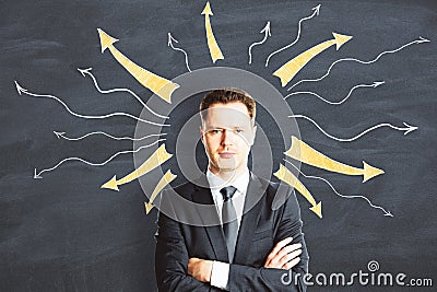 Young businessman in suit with drawn many arrows over her head Stock Photo