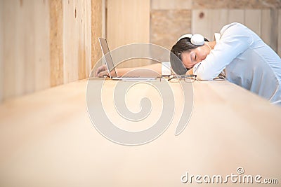 Young businessman take a nap in workspace Stock Photo