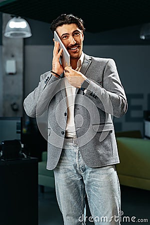 Young businessman talking on diigital tablet in the office Stock Photo