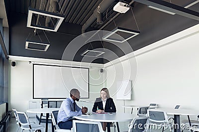 Young businessman waiting for departure in airport, work trip, business lifestyle Stock Photo