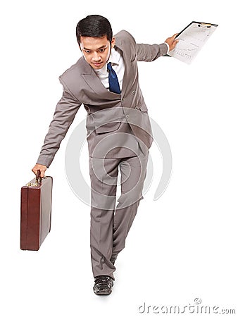 Young businessman walking maintain balance Stock Photo