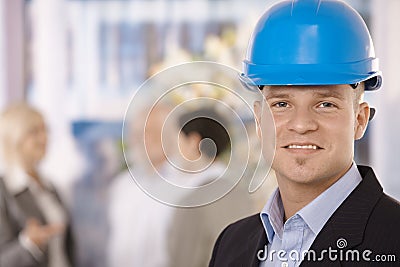 Young businessman wearing hardhat Stock Photo