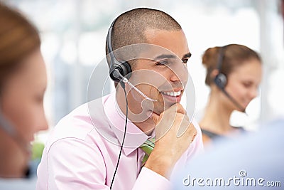 Young businessman wearing headset Stock Photo