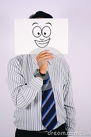 Young Businessman Wearing smile widely Mask isolated on white Stock Photo