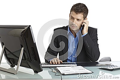 Young businessman working at desk Stock Photo