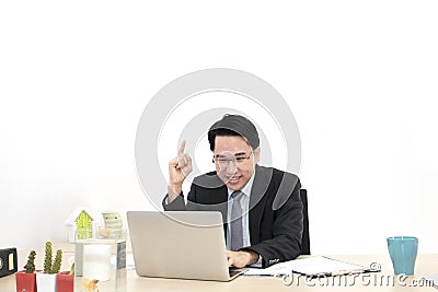 Young businessman working with laptop and office Supplies. Stock Photo