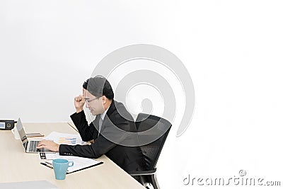 Young businessman working with laptop and office Supplies. Stock Photo