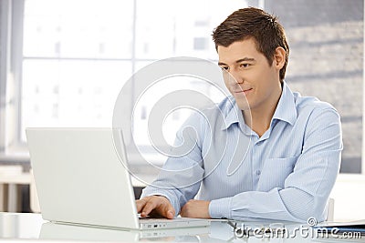 Young businessman working in office Stock Photo