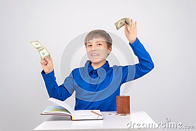 Young businessman Young smart boy enjoys his small financial ach Stock Photo
