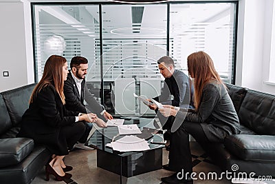 Young businesspeople group working together planning corporate startup project in teamwork Stock Photo