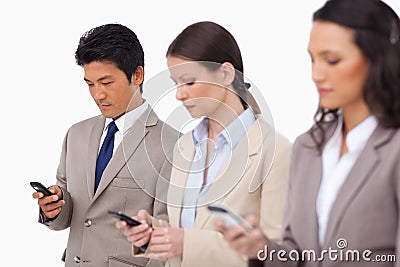 Young businessteam with their cellphones Stock Photo