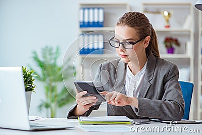 The young businesswoman accountant working in the office Stock Photo