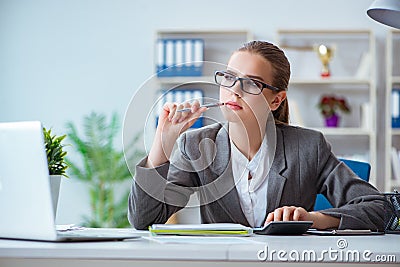 The young businesswoman accountant working in the office Stock Photo