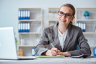 The young businesswoman accountant working in the office Stock Photo