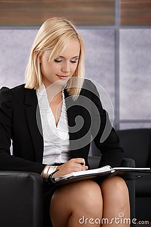 Young businesswoman checking personal calendar Stock Photo