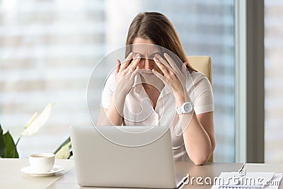 Young businesswoman doing exercises to relieve tired of computer Stock Photo