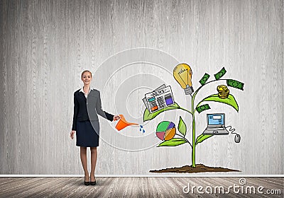 Young businesswoman in empty room watering drawn growth concept with can Stock Photo