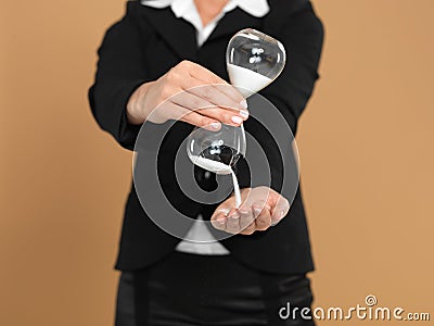 young businesswoman holding broken hourglass Stock Photo