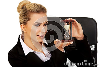 Young businesswoman holding a hourglass Stock Photo