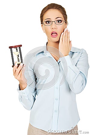 Young businesswoman with hourglass. Stock Photo