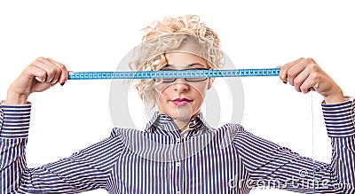 Young businesswoman with measurnig tape Stock Photo