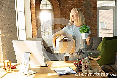A young businesswoman moving in office, getting new work place Stock Photo