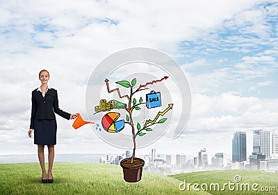 Young businesswoman outdoors watering drawn growth concept with can Stock Photo