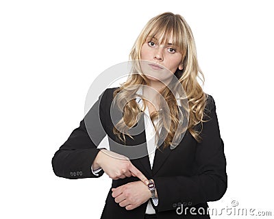 Young businesswoman pointing to her watch Stock Photo