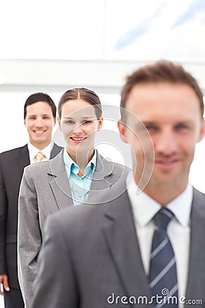 Young businesswoman posing with two businessmen Stock Photo