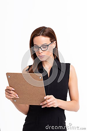 Young businesswoman reviewing checklist isolated Stock Photo