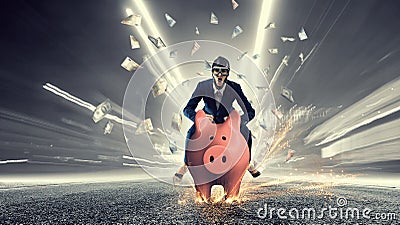 Young businesswoman riding on piggy bank, isolated on white. Saving concept Stock Photo