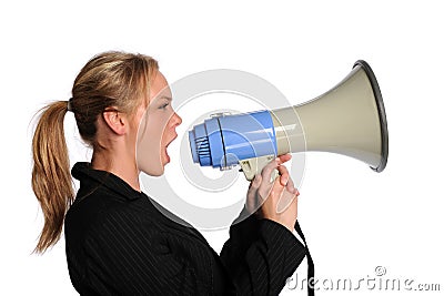 Young businesswoman screaming with a megaphone Stock Photo