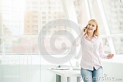 Young businesswoman sitting at office Stock Photo