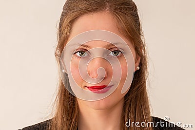 Young businesswoman smiling on bright background from close up Stock Photo