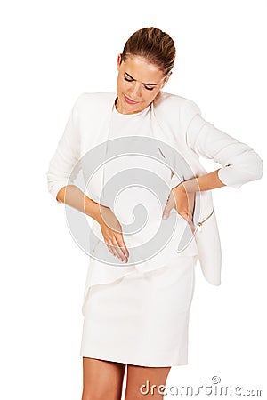 Young businesswoman suffering from stomach ache Stock Photo