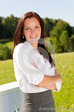 Young businesswoman sunny nature attractive smile Stock Photo