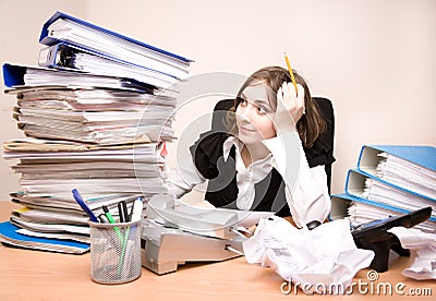 Young businesswoman with tons of documents Stock Photo