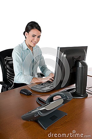 Young businesswoman typing at computer, isolated Stock Photo