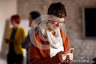 Young businesswoman using mobil phone Stock Photo