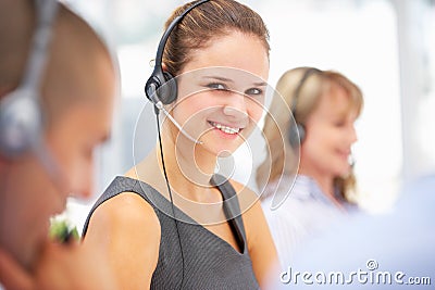 Young businesswoman wearing headset Stock Photo