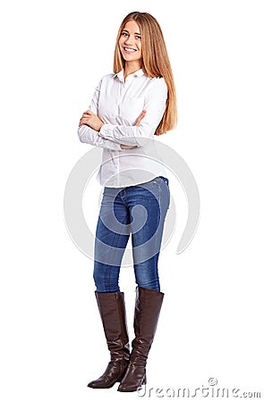 Young businesswoman in white shirt standing with crossed arms Stock Photo