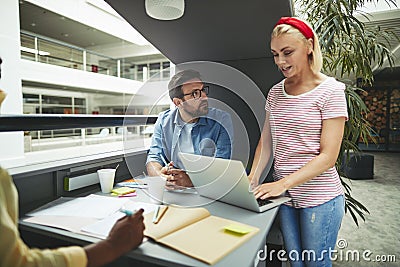 Young businesswoman working with colleagues in a office meeting Stock Photo