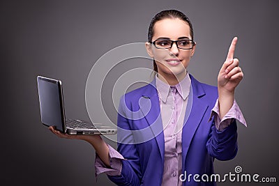 The young businesswoman working with laptop in business concept Stock Photo