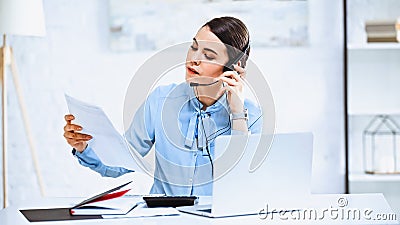 young call center operator looking at Stock Photo
