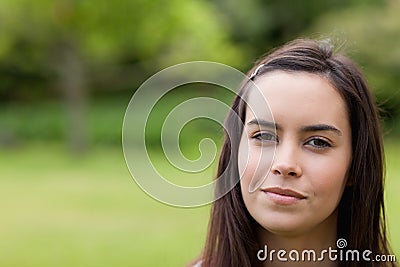 Young calm woman outdoors in a park Stock Photo