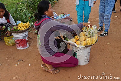 Young Cambodian woman sells fruit Editorial Stock Photo