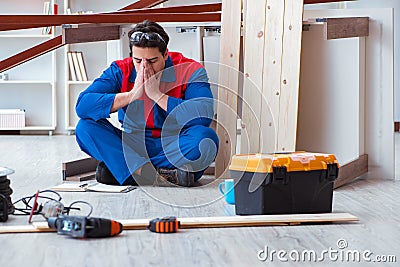 The young carpenter at work tired feeling not well Stock Photo